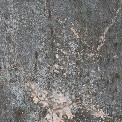 Rough textured wall with stains