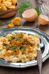 delicious scrambled eggs with chanterelles and fresh dill