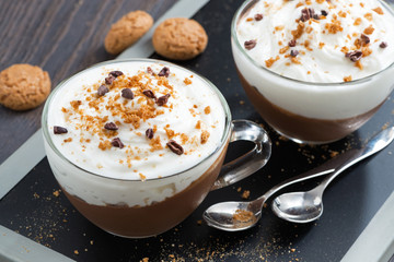 dessert with chocolate, cream and amaretti in glass cups