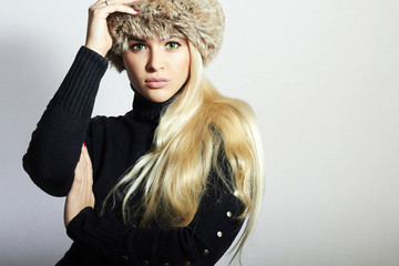 Beautiful Young Woman in Fur Hat.Blond Girl. Winter Fashion