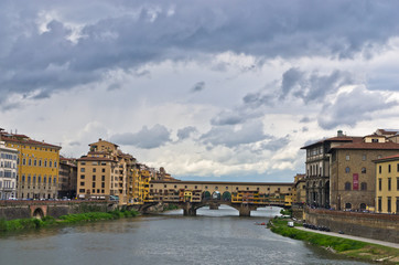 Fototapeta premium Ponte Vecchio bridge and architecture along river Arno, Florence