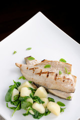 Grilled white fish fillets with potato and spinach