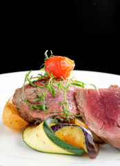 Juicy grilled bbq steaks with fresh herbs, vegetable