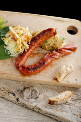 Grilled sausage with cabbage and mashed potatoon