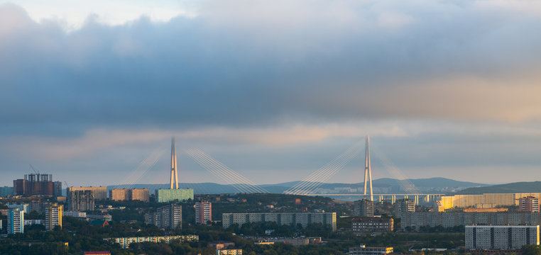 Vladivostok, bridge. Sunset. Cloudy sky.