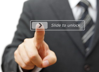 Businessman slide a virtual button to unlock system