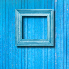 Obraz na płótnie Canvas Vintage frame for picture on blue wooden wall