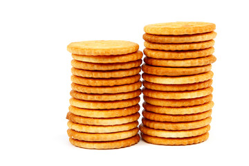 Stack of cracker biscuits isolated on a white background.