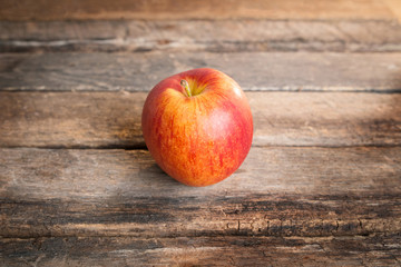 red apples on wooden table