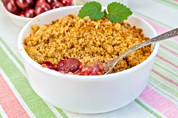 Crumble cherry with berries on napkin