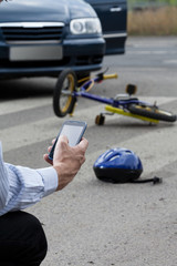 Man using his mobile phone to call for help on road