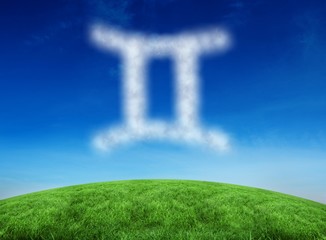 Composite image of cloud in shape of gemini star sign