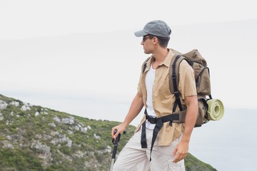 Fototapeta na wymiar Hiking man walking on mountain terrain