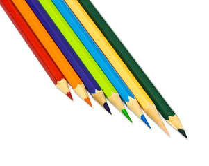 Colour pencils on white background close up