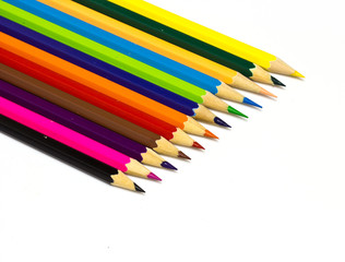 Colour pencils on white background close up