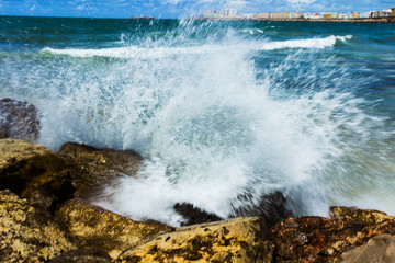 Waves splashing rocks