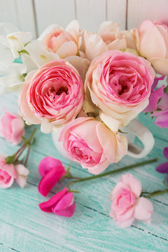 Fresh roses on wooden background