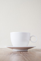 Cup of coffee on wooden table