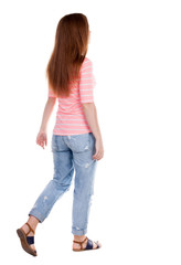 Obraz premium back view of walking woman .