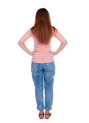 Fototapeta premium back view of standing young beautiful redhead woman.