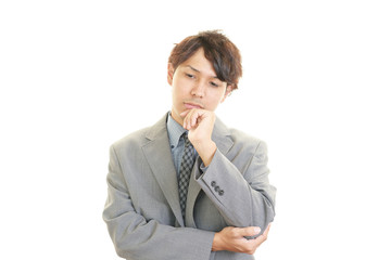 疲れた表情のビジネスマン