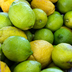 Green lemons in the market