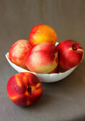 Nectarines in a plate.