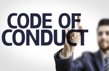 Business man pointing the text: Code Of Conduct