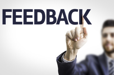 Business man pointing the text: Feedback