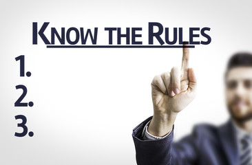 Business man pointing the text: Know the Rules