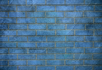 Old weathered stained blue brick wall background