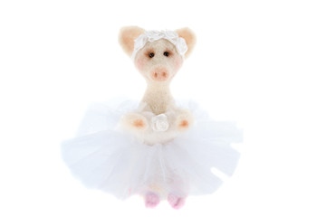 White toy pig in a tutu