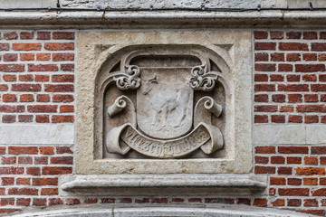 Old historical wall decor plate in Gent, Flanders, Belgium