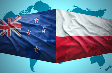 Waving New Zealand and Polish flags