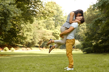 Fototapeta premium Couple in Love. Happy couple kissing in the park.