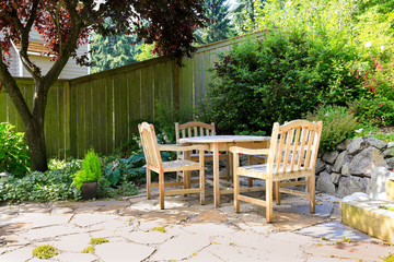 Outdoor rest area with rustic table and chairs