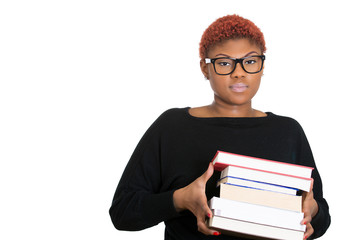 Female teacher, student with glasses holding pile of books