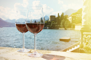 Two wineglasses. Varenna town at the lake Como, Italy