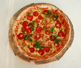 Delicious fresh pizza served on wooden plate