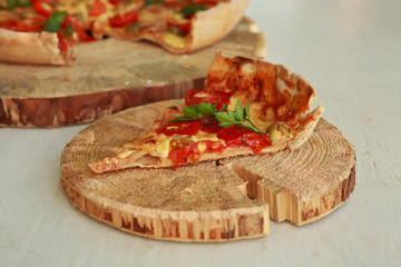 Delicious fresh pizza served on wooden plate