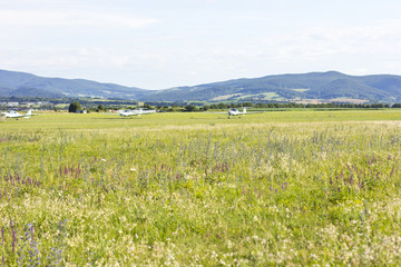 Fototapeta premium mountain landscape with a small plane in the background