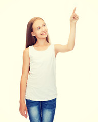 girl in blank white shirt pointing to something