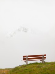 Obraz premium White misty evening on the hill in Switzerland Alps.