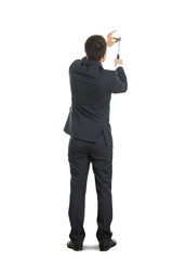 Obraz premium man hammering against a white wall