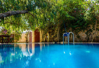 Big blue pool in the middle of backyard