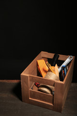 Wooden box with different tools,