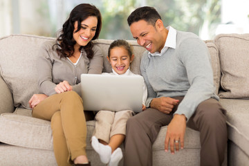 Fototapeta na wymiar family using laptop