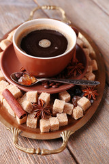 Obraz na płótnie Canvas Brown sugar, spices and cup of coffee