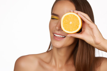 Beautiful woman holding orange healthy eating organic food diet
