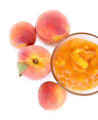 tasty peach jam with fresh peaches, isolated on white